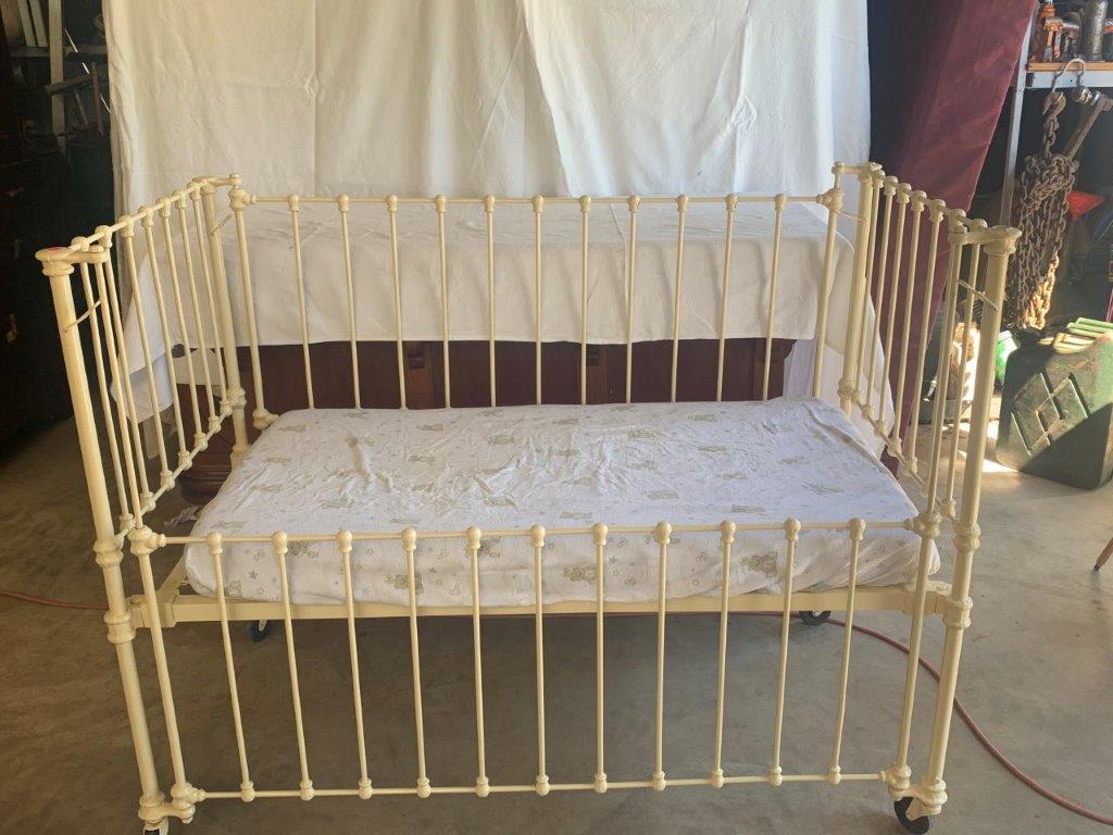 Lot 166 Cast iron cot on castors AuctionsPlus