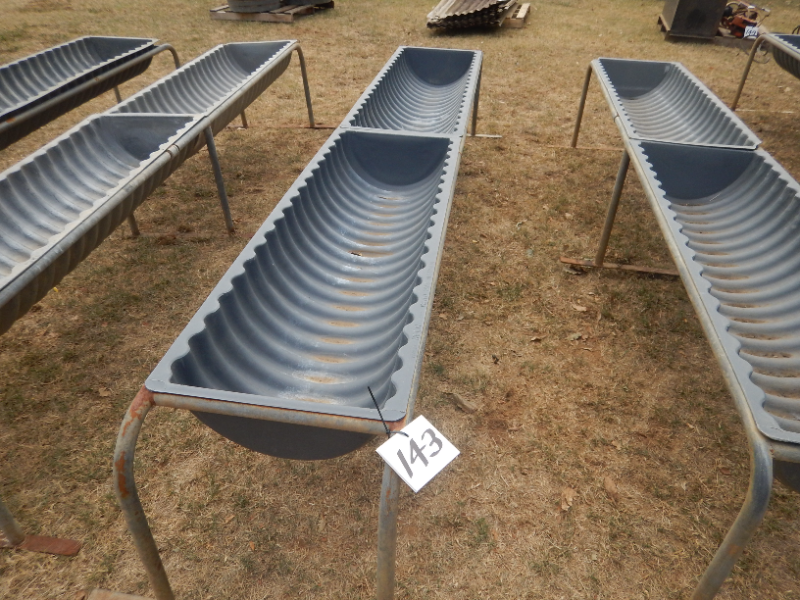 Lot 143 1 x ( 2 x 5' ) Poly feed troughs on heavy pipe frame