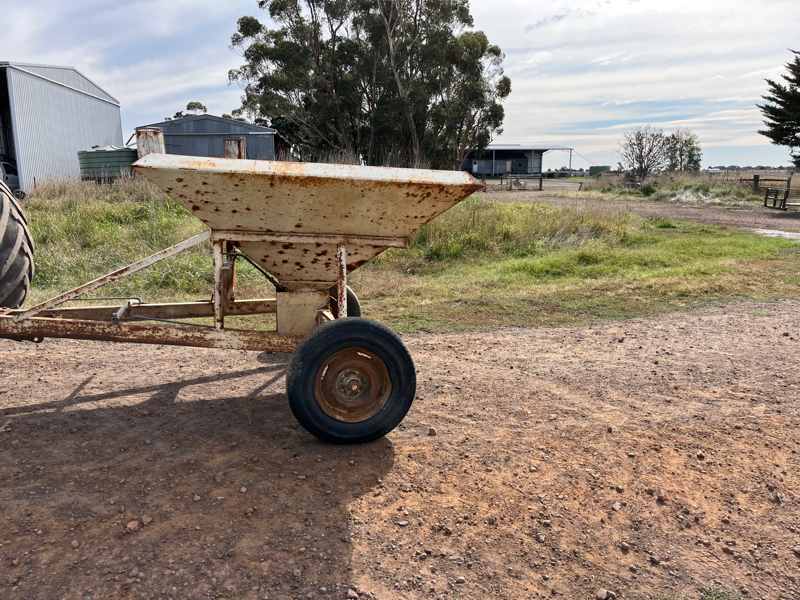 Lot 73 Tow behind Grain feeder. AuctionsPlus