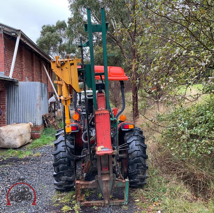 Lot 2 Munroe post driver with auger AuctionsPlus