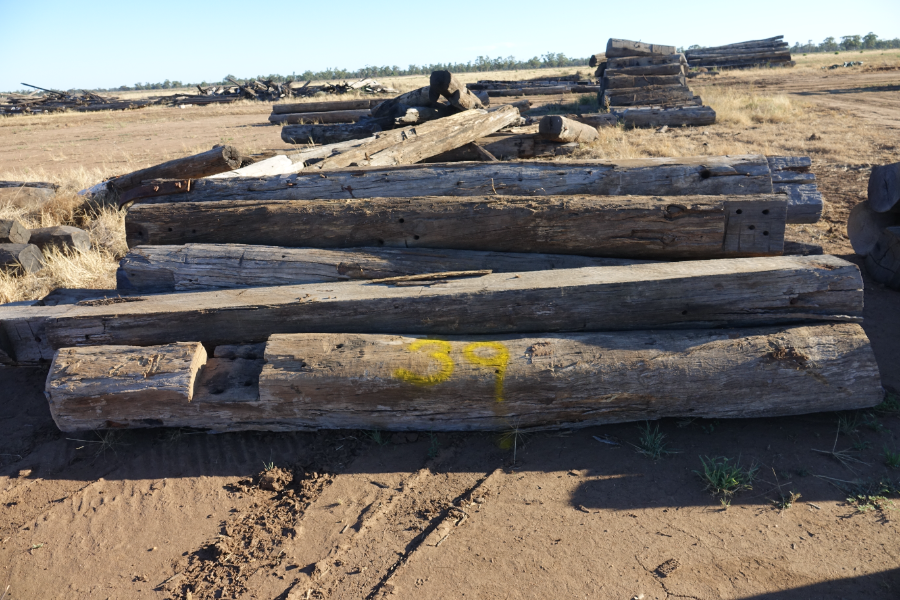 Lot 39 - 12 X TIMBER PILES IRON BARK POST | AuctionsPlus
