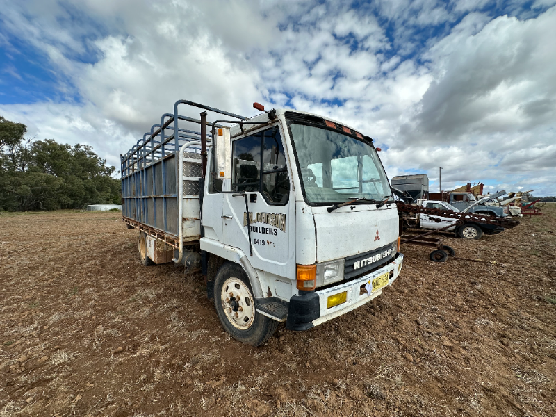 Lot 6 - Mitsubishi FK415 truck with stock crate | AuctionsPlus