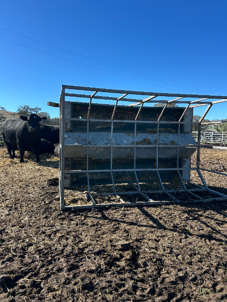 Lot 39 - Steel Hay rack with poly trough bottom. | AuctionsPlus
