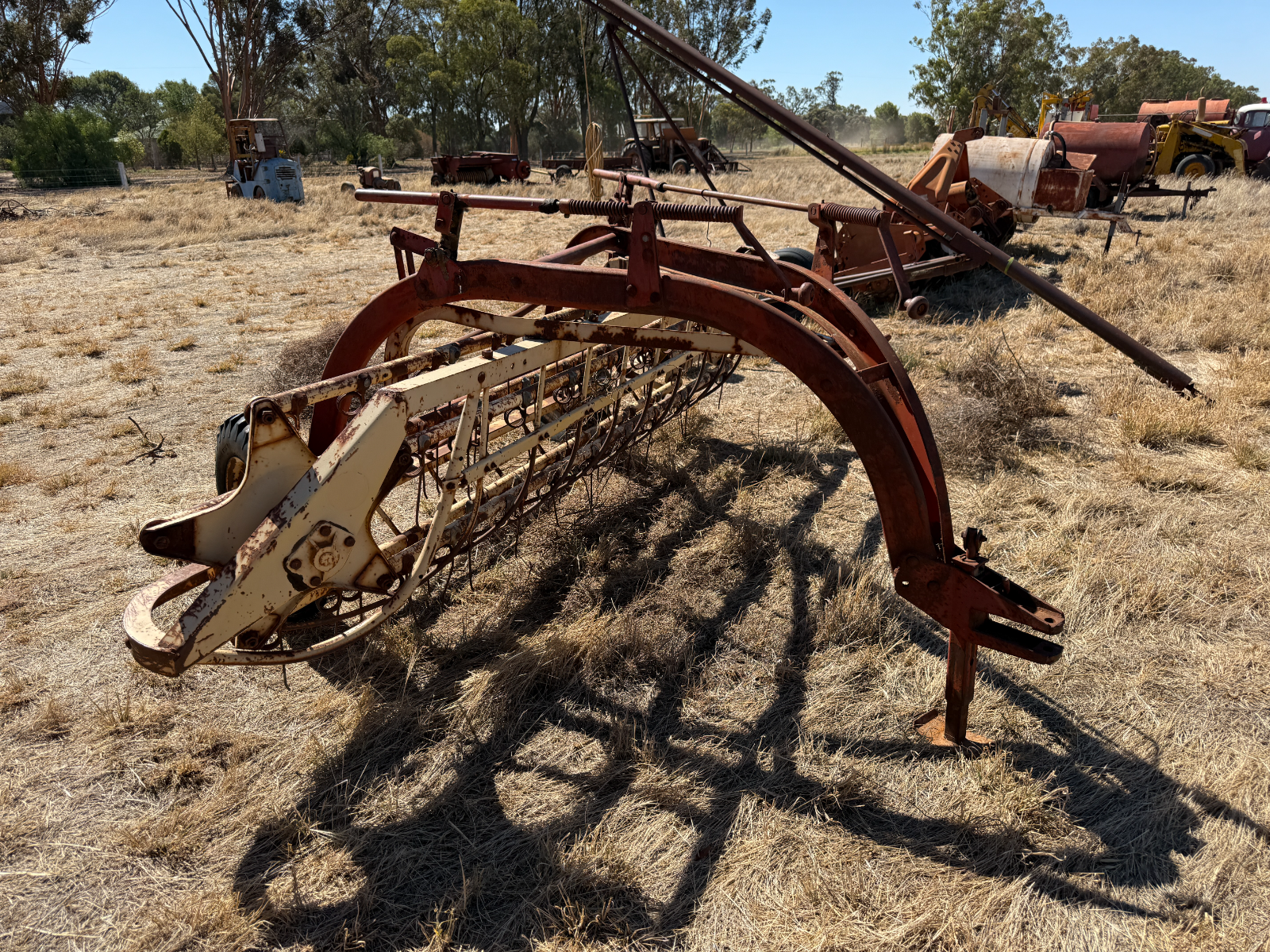 Lot 43 - New Holland Roller Bar Hay Rake | AuctionsPlus