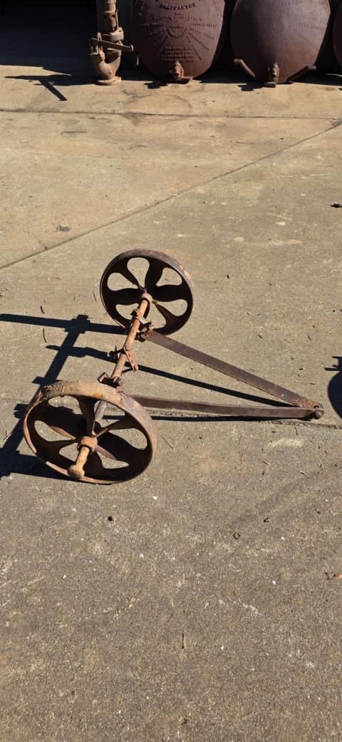 1 small set of Cast Wheels on Axle and Front Bar