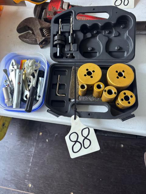 Lot 88 · Hole saw kit + spark plugs